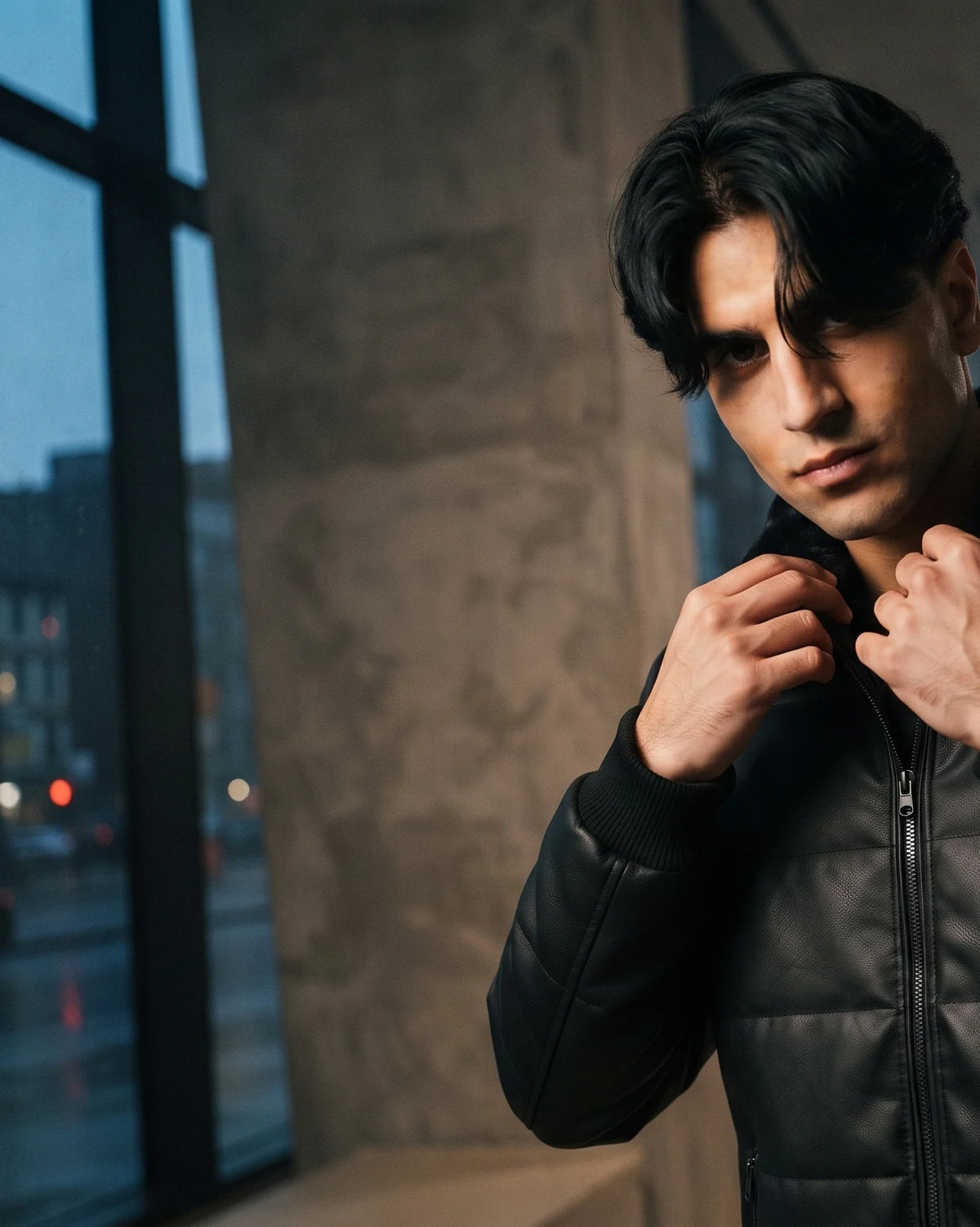 Zaryash black faux leather bomber jacket, adjusting the faux-fur collar